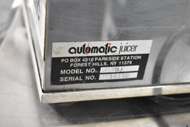 Automatic MJ food processor label showing model MJ, serial 18736, and contact details for Forest Hills, NY.