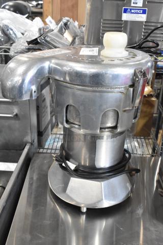 Stainless steel commercial countertop juicer, 115 volts, 1 phase, includes power cord. Used condition with wear marks.