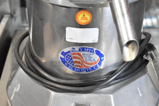Stainless steel commercial countertop juicer, 115 volts, 1 phase. Features USA-made label and a power cord.