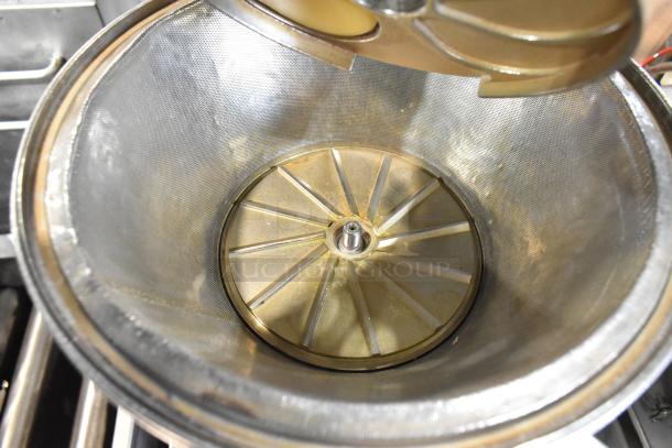 Stainless steel commercial countertop juicer, featuring a mesh strainer and strong motor assembly. 115 volts, 1 phase.