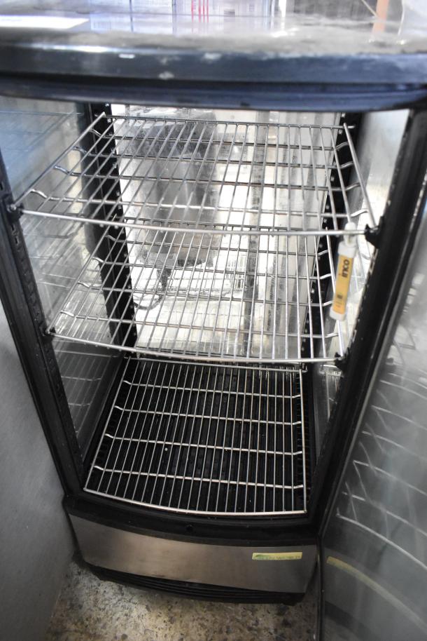 Green World CRT-77-1R metal mini cooler merchandiser, 115 volts, 1 phase. Features wire shelves, glass door, and stainless base.