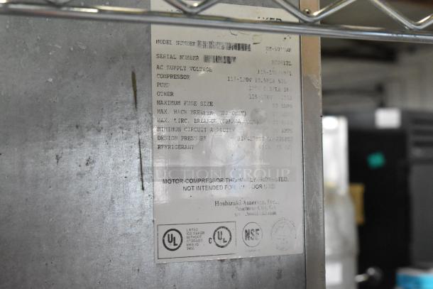 Hoshizaki KM-501MWH ice maker label on stainless steel unit. Specifications include 115-120V, 1 phase. UL and NSF certified.