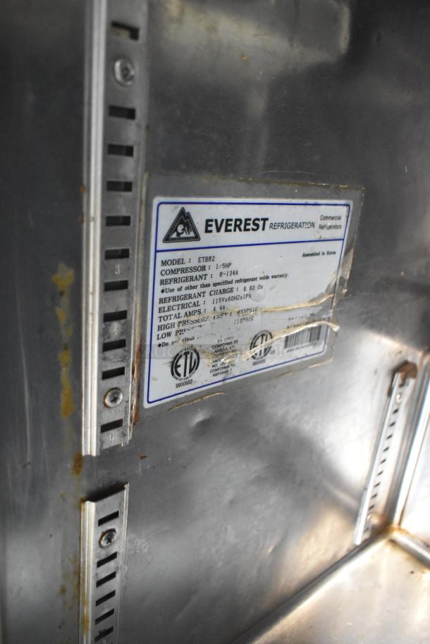 Everest ETBR2 stainless steel undercounter cooler with visible model label, indicating 115 volts and 1 phase power.