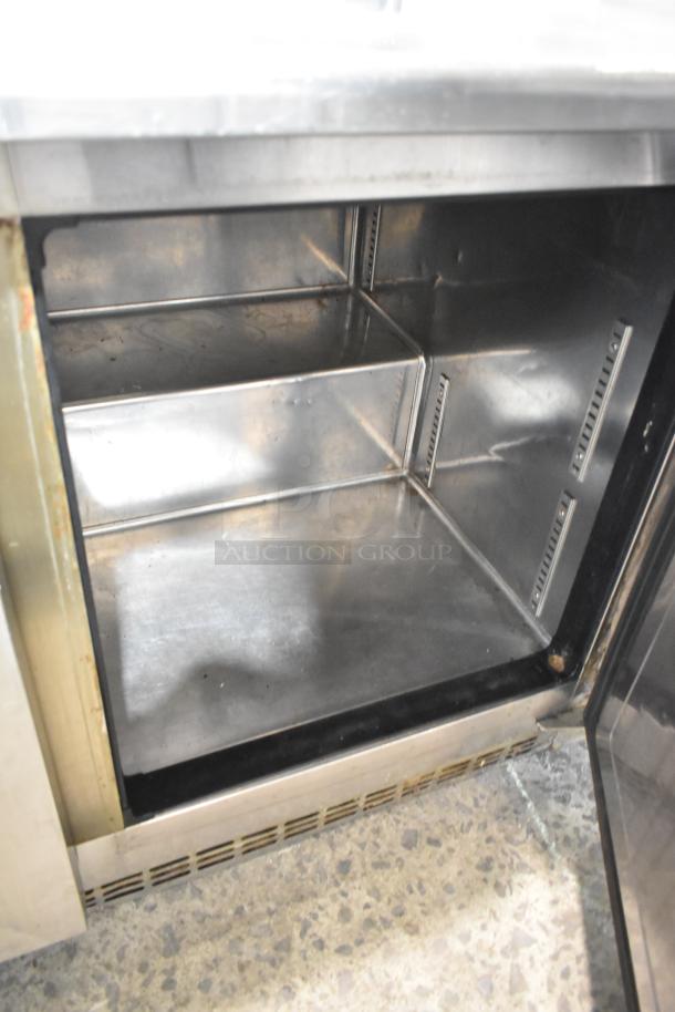 Everest ETBR2 stainless steel 2-door undercounter cooler, commercial-grade, 115V, interior view, some wear visible.