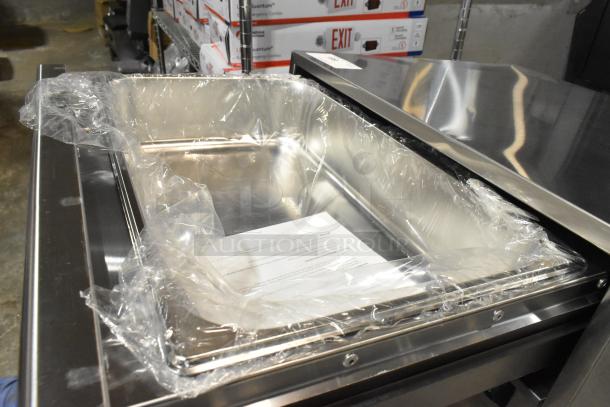 Brand new Avantco 177BW32 stainless steel warming drawer with minor dents, plastic covered, 120V, 1 Phase.