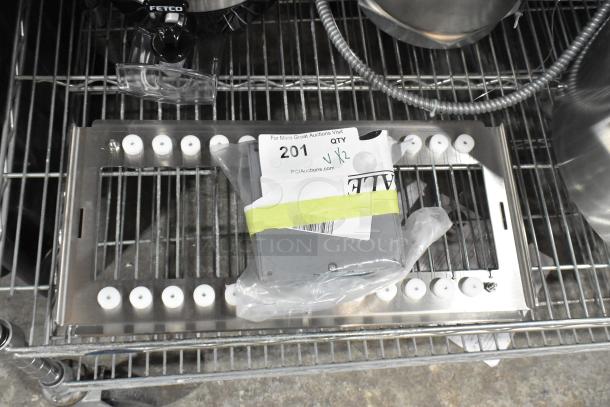 Brand new Fenwal unit and cutter, scratch and dent condition, on metal shelf, auction tag visible with lot number 201.