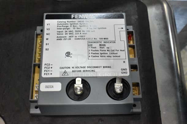 Fenwal ignition system unit, model 2462D 501, brand new, with diagnostic indicator panel and caution label visible.