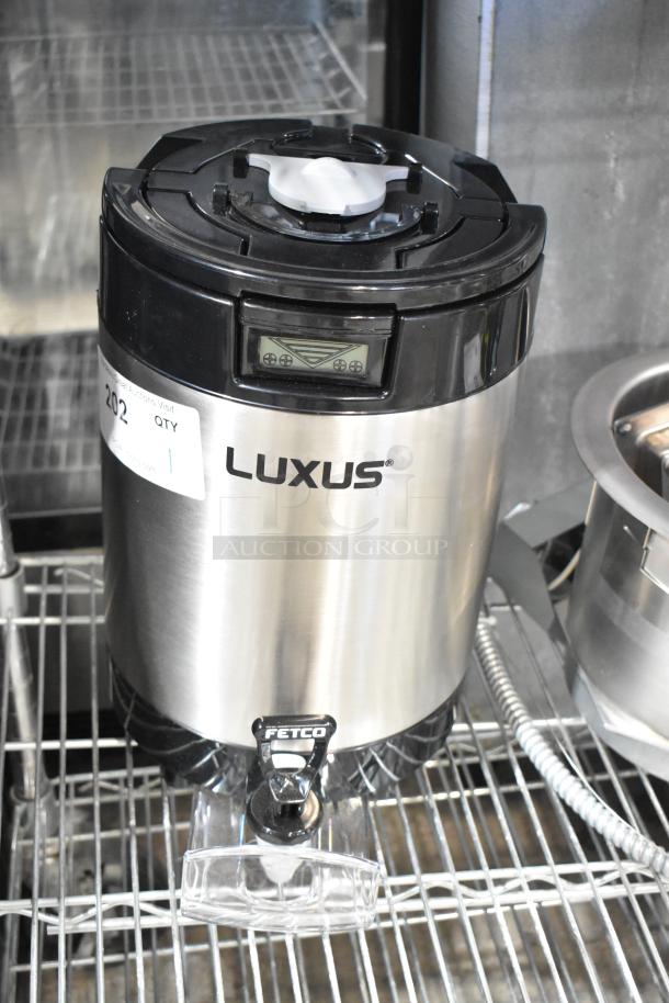 BRAND NEW Fetco Luxus L4S-15 1.5-gallon stainless steel coffee server, minor scratches and dents, digital display, sturdy spout.
