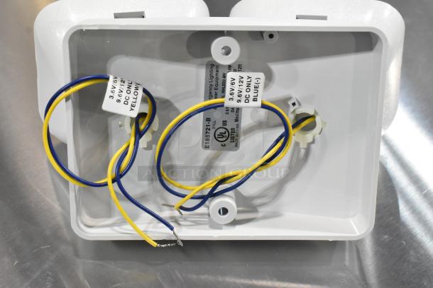 7 brand new ASRLED-2-HL/TSR-W-REM emergency lights, yellow and blue wires visible, UL certified.