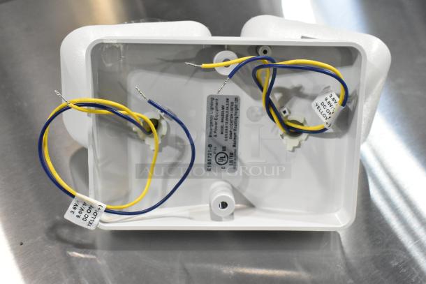 7 new ASRLED-2-HL / TSR-W-REM emergency lights; minor scratches and dents; wiring and UL label visible.