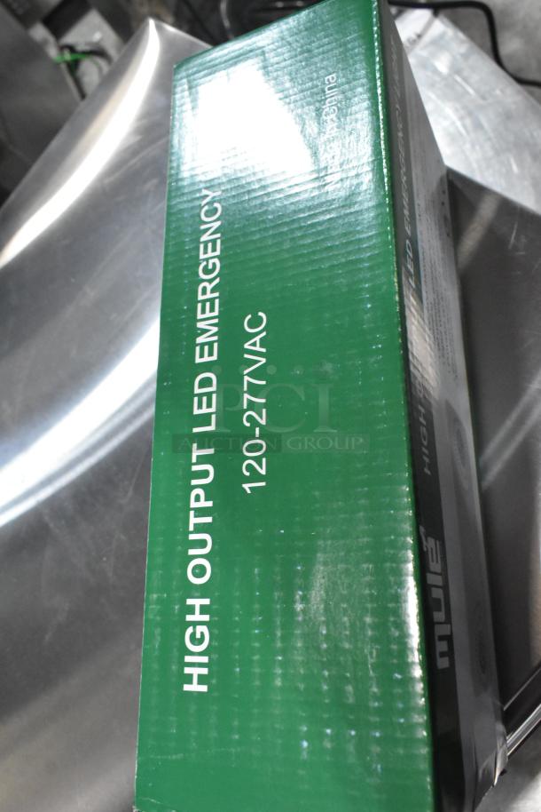 Box labeled "High Output LED Emergency 120-277VAC" in green with "Made in China." Condition: Scratch and Dent.