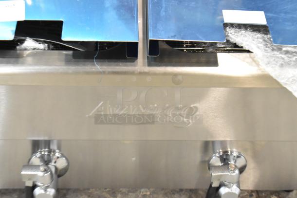Brand new Avantco 177F202 stainless steel dual tank electric fryer, 30 lb., includes 2 baskets and lids, 208-240V, 1 Phase.