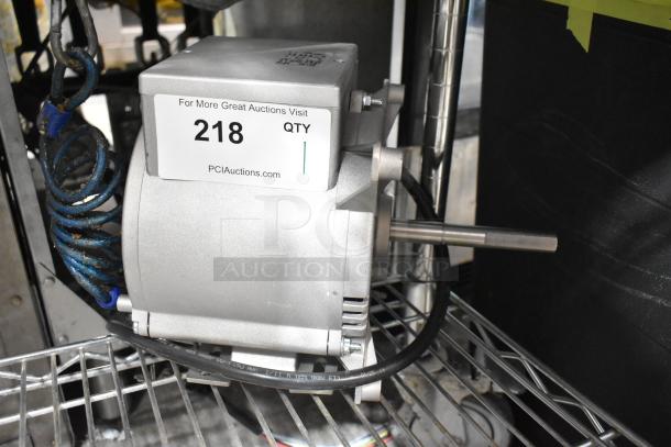 Brand new Nidec motor, 115-120V, 1 phase, minor cosmetic dents, visible label with auction info, silver housing.