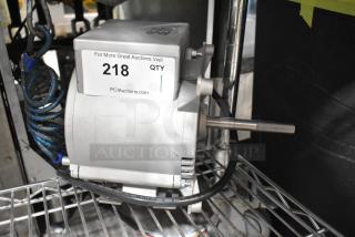 Brand new Nidec motor, 115-120V, 1 phase, minor cosmetic dents, visible label with auction info, silver housing.