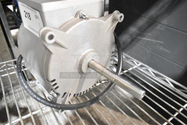 Brand new Nidec motor, 115-120V, 1 phase. Scratch and dent condition. Tag reads "218, Qty 1," from PDUuctions.com.