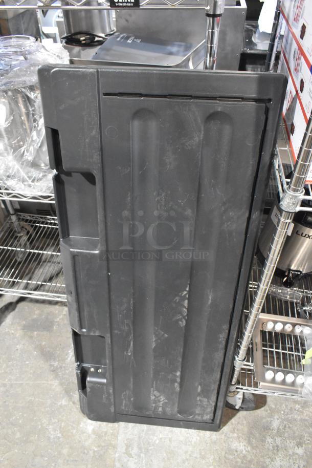Black poly ice bin lid, brand new with minor scratches, durable plastic construction, ideal for commercial use.