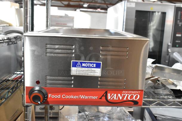 Brand new Avantco 177W50CKR stainless steel electric food warmer, 12"x20". Scratch and dent condition, with notice label.