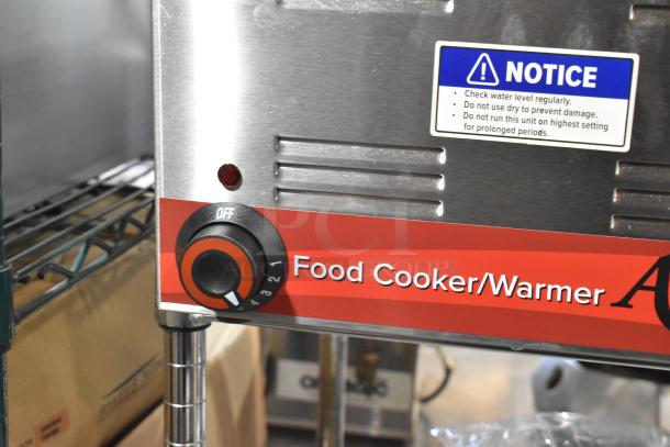 Brand new Avantco 177W50CKR stainless steel countertop food warmer, 12" x 20". Features control dial, warning label. 120V.