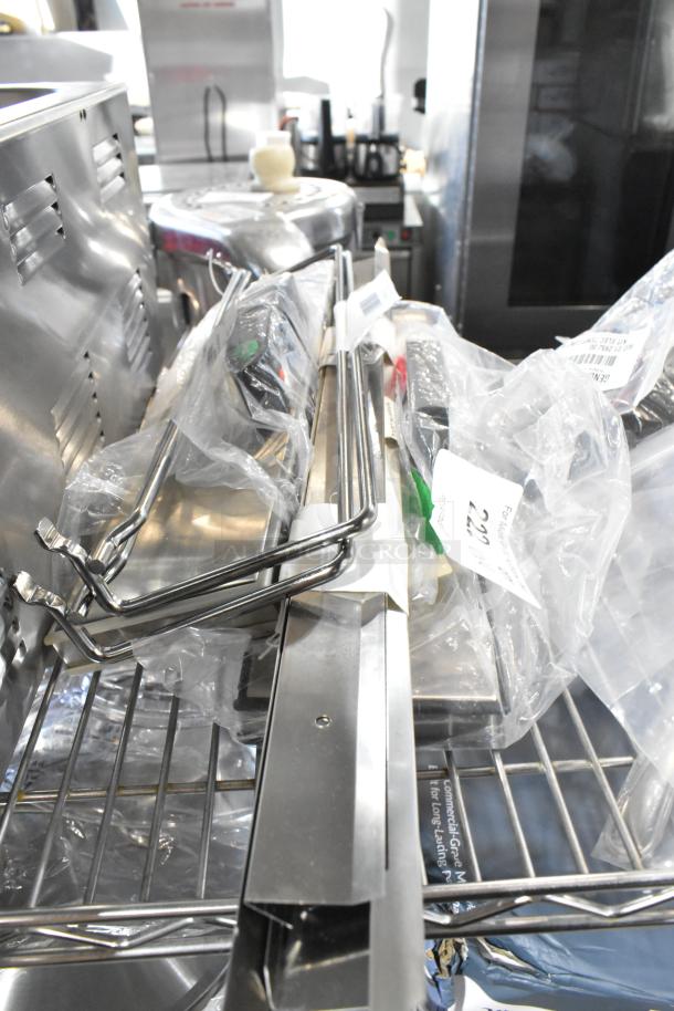 Four brand new Cres Cor 0621 281 K elements and VacPak-It lids in original packaging, on stainless steel rack.