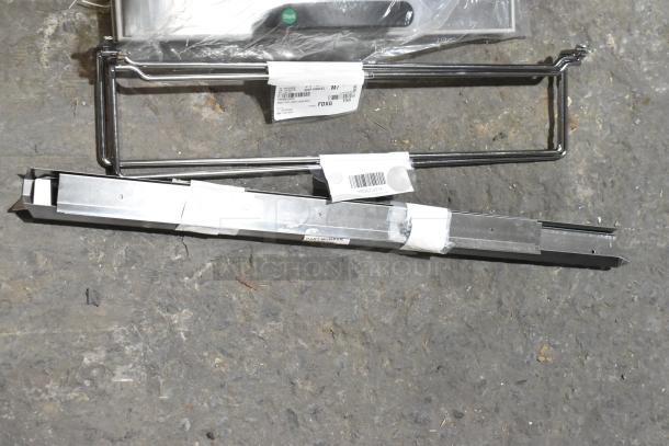 Four brand new items including Cres Cor 0621 281 K Angles Kit and VacPak-It lids, labeled and packaged, on concrete.