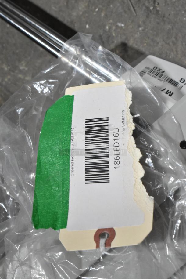 4 Brand New Scratch and Dent Items; visible: VacPak-It Ultima Lid 186LED16U tag, green tape, barcode, clear wrap.