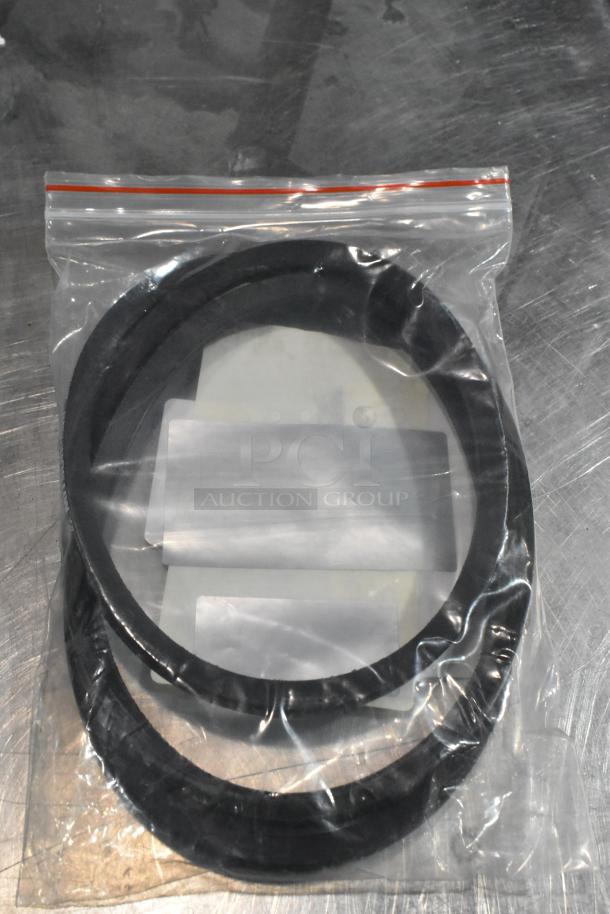 Bag with two black rubber belts, likely Estella Upper Belt for SM100, SM130, and SM160, in new condition.