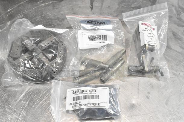 Four brand new scratch and dent items: Avantco microswitch sleeve, Blodgett spring holder, Garland burner head, Hatco temp control kit.