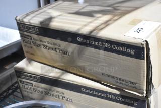 Two boxes of Baker's Lane 176BUNHALFNS half-size wire in rim aluminum sheet pans, 18 gauge, non-stick, new condition.