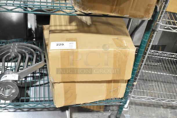 Two boxes of 12 Hobart Baker's Lane 176BUNHALFNS non-stick aluminum bun pans. Scratch and dent condition.