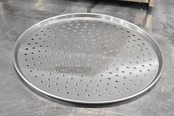 Hobart HL80B metal round perforated baking screen, new condition, with minor scratches and dents. Contains 22 pieces.