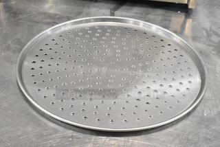 Hobart HL80B metal round perforated baking screen, new condition, with minor scratches and dents. Contains 22 pieces.
