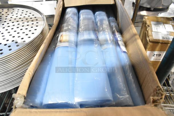 Two boxes of 12 Baker's Mark BM176WMATSBCRC 36"x24" blue translucent silicone mats, new condition in original packaging.