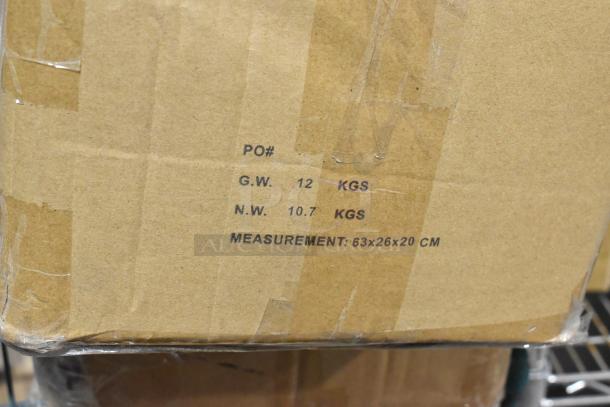 Cardboard box labeled with weights 12 kg gross, 10.7 kg net, and dimensions 63x26x20 cm containing 2 boxes of Baker's Mark silicone mats.