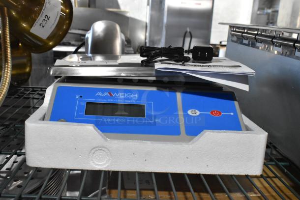Brand new AvaWeigh 334PC40OS 40 lb. digital scale with oversized platform. Includes cord and manual. In original packaging.