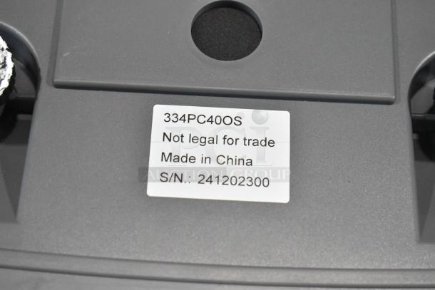 AvaWeigh 334PC40OS 40 lb. digital scale with oversized platform, scratch and dent, label shows "Not legal for trade", made in China.