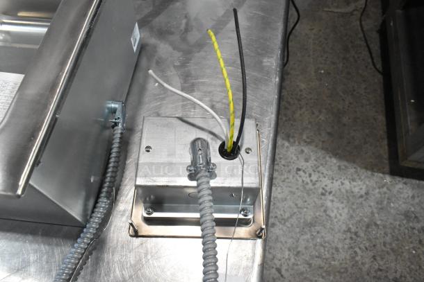 Brand new Avantco 177TM12H stainless steel drop-in hot food well with visible wiring and drain, 240V, 1 Phase.