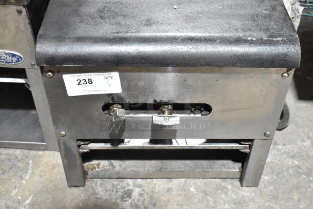 2021 stainless steel commercial gas stock pot range with single burner, 110,000 BTU, auction tag visible, used condition.