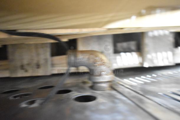 Cook Rite stainless steel gas-powered single burner stock pot range, focusing on gas connection detail.