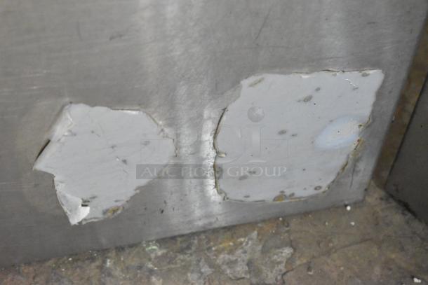 Cook Rite stainless steel commercial gas burner stock pot range, showing peeling labels indicating wear.