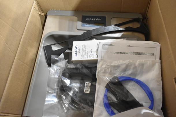 Brand new Zurn Elkay LZSTL8WSLK ezH20 bottle filling station in box, light gray, hands-free, 8 GPH, vandal-resistant, chilled.