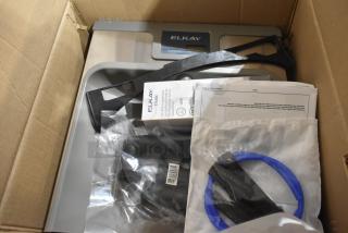 Brand new Zurn Elkay LZSTL8WSLK ezH20 bottle filling station in box, light gray, hands-free, 8 GPH, vandal-resistant, chilled.