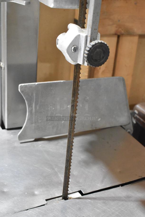 Hobart Metal Commercial Floor Style Meat Saw, robust construction, visible blade adjustment mechanism, good condition.