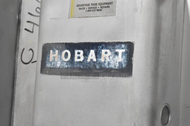 Hobart commercial floor meat saw, metal body, visible brand marking. Good condition with service label.