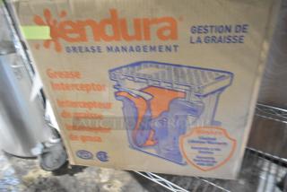BRAND NEW Endura 4543907A02 Grease Trap, 14 lb., 7 GPM, 2" hub, scratch and dent condition. Box labeled with product details.