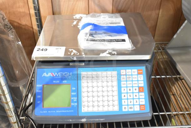 Brand new AvaWeigh 334PCSP60 scale with thermal label printer, slight cosmetic scratches, intact label pads.