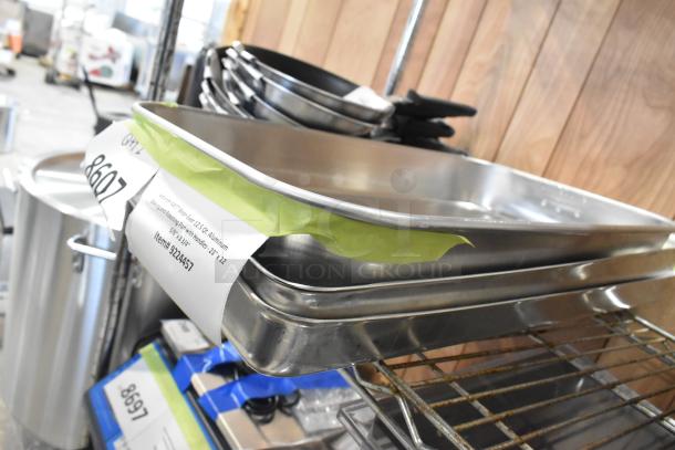 11 brand new scratch and dent items, featuring a Vollrath 4457 aluminum baking and roasting pan with handles, 23" x 12 5/8" x 2 3/4".