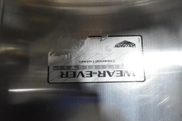 Vollrath Wear-Ever label on a 12.5 Qt. aluminum baking and roasting pan, minor scratches visible.