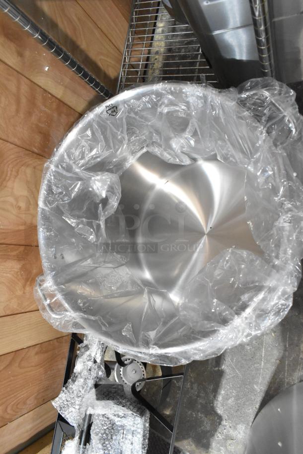 Brand new stainless steel stock pot with minor scratches, wrapped in plastic. Includes lid, set of two.