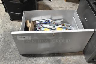 Brand new metal drawer with various Advance ballasts, scratch and dent condition, label marked "259 QTY 1."