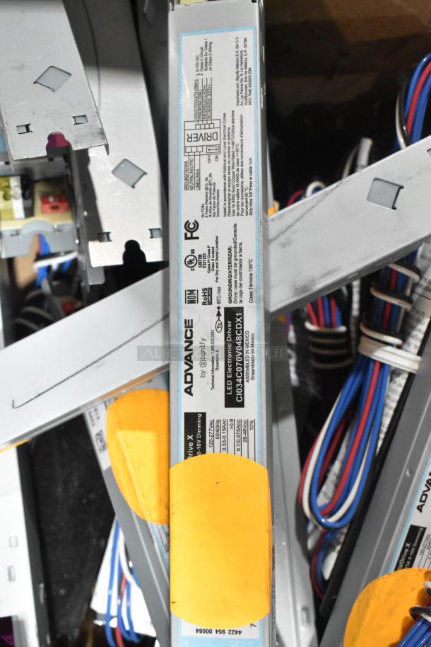 Brand new metal drawer with various Advance LED electronic drivers, labeled CI034C070V048CDX1; scratch and dent condition.